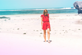 Woman Wearing Red Romper on Beach Woman Wearing Red Romper on Beach