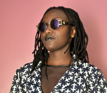 Woman Wearing Silver Framed Hippie Sunglasses Woman Wearing Silver Framed Hippie Sunglasses