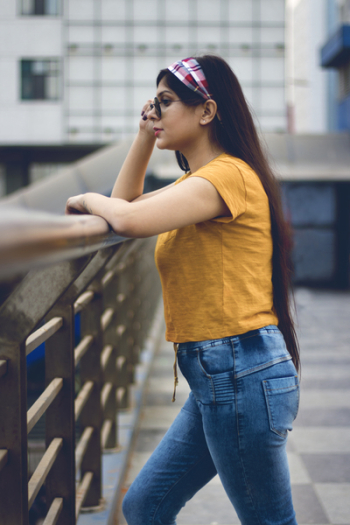 Woman Wearing Sunglasses Near High-rise Buildings Woman Wearing Sunglasses Near High-rise Buildings