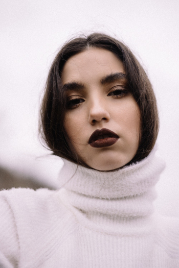 Woman Wearing White Turtleneck Sweater Woman Wearing White Turtleneck Sweater