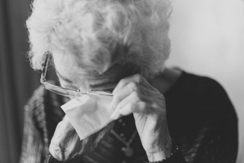 woman wiping her eyes woman wiping her eyes