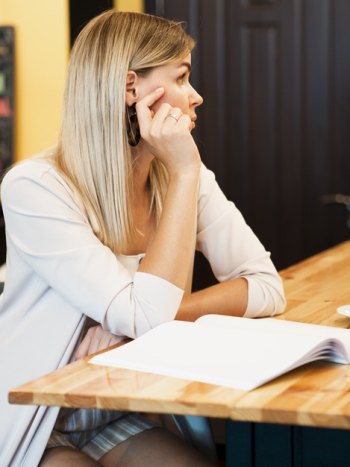 Woman with a mock-up magazine Free Photo