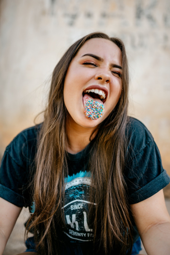 Woman With Candies on Tongue Woman With Candies on Tongue