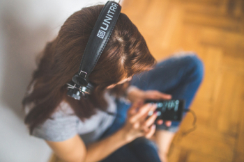 Woman with headphones listening music Woman with headphones listening music