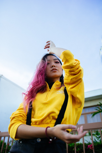 Woman With Pink Dyed Hair Wearing Yellow Jacket Woman With Pink Dyed Hair Wearing Yellow Jacket