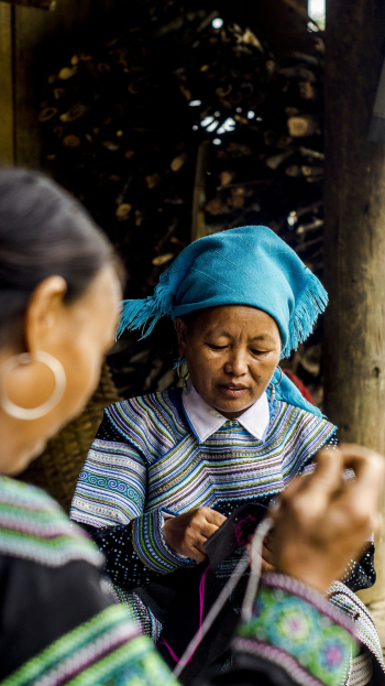 Women Making Knitted Wear Women Making Knitted Wear