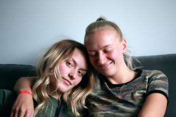 Women Sitting On Couch Women Sitting On Couch