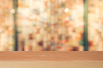 Wooden board empty table in front of blurred background. perspective brown wood over blur in coffee shop