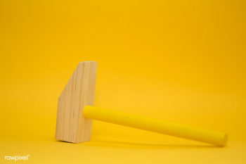 Wooden mallet on yellow background | Free public domain photo - 432214 Wooden mallet on yellow background | Free public domain photo - 432214