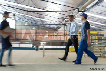 Workers and manager working in factory Workers and manager working in factory