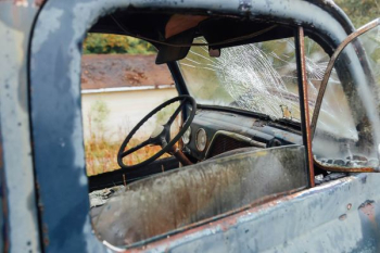 wrecked vehicle with broken windshield wrecked vehicle with broken windshield