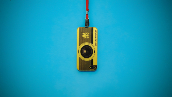 Yellow 212 Vip Camera Hanging on Blue Wall