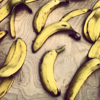 Yellow Bananas on Brown Wood Yellow Bananas on Brown Wood