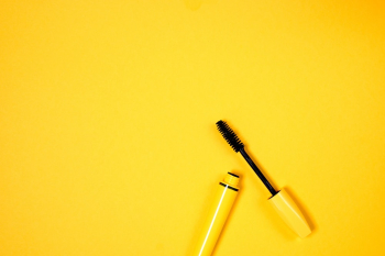 Yellow Mascara on Yellow Background Yellow Mascara on Yellow Background