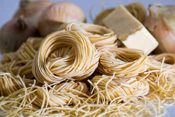 Yellow Pasta Beside Onions Yellow Pasta Beside Onions
