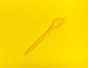 Yellow Spoon On A Yellow Background Yellow Spoon On A Yellow Background
