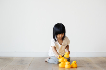 Young Asian girl playing alone Young Asian girl playing alone