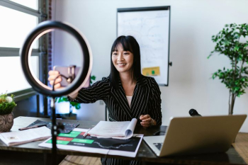 Young Asian Woman Engaging in Remote Work with Ring Light Young Asian Woman Engaging in Remote Work with Ring Light