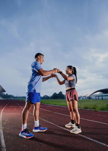 Young Athletes Celebrating a Relay Race Victory Young Athletes Celebrating a Relay Race Victory