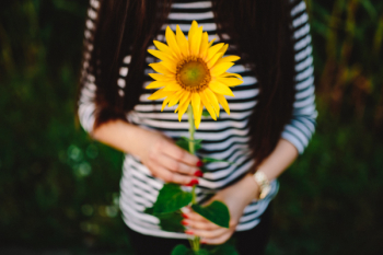 Young couple with sunflower Young couple with sunflower
