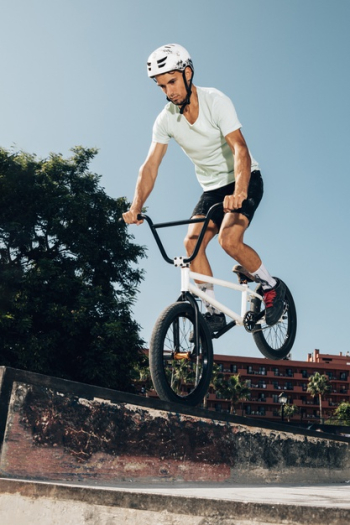 Young man jumping with bicycle Free Photo