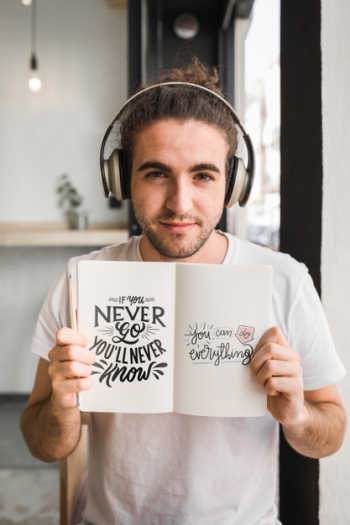 Young man with a open book mockup Free Psd