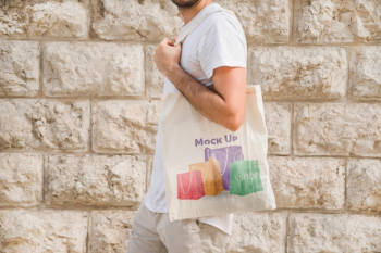 Young man with bag mockup Free Psd