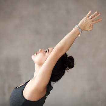 Young woman doing virabhadrasana 1 exercise Young woman doing virabhadrasana 1 exercise