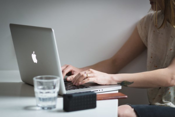 Young Woman Typing Macbook Young Woman Typing Macbook