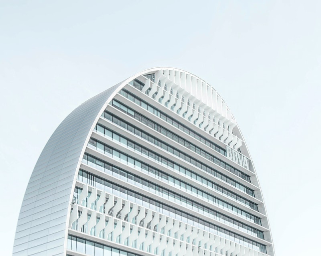 A modern skyscraper with a rounded | Free Photo - rawpixel