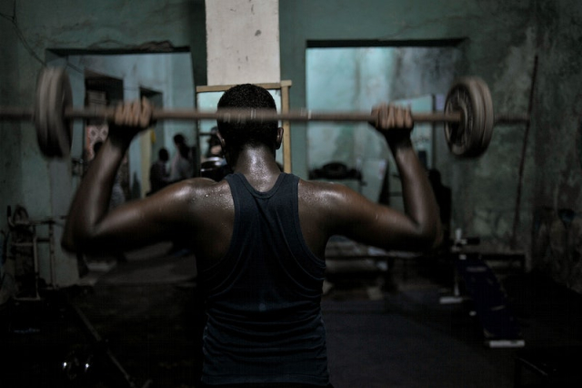 A Somali man lifts weights | Free Photo - rawpixel