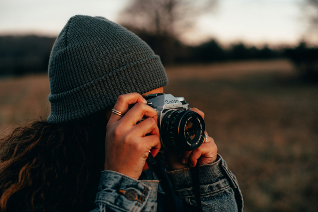 Adventurous Photographer in Nature with Vintage Camera
