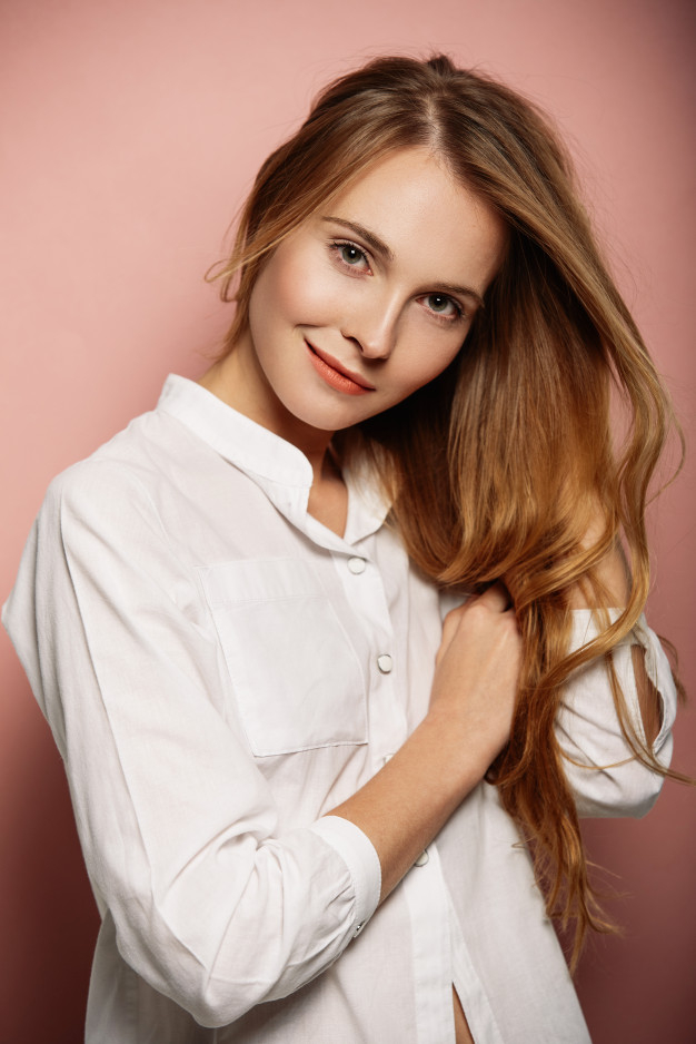 Attractive girl portrait in a white shirt Free Photo