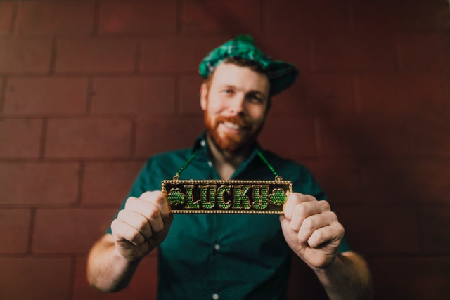 Bearded Man Showing off His Necklace