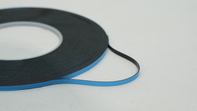 Black and Blue Electrical Tape Roll on a White Background