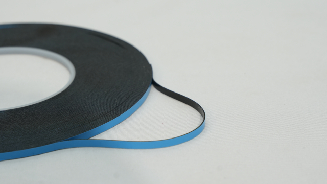 Blue and Black Adhesive Tape on White Background