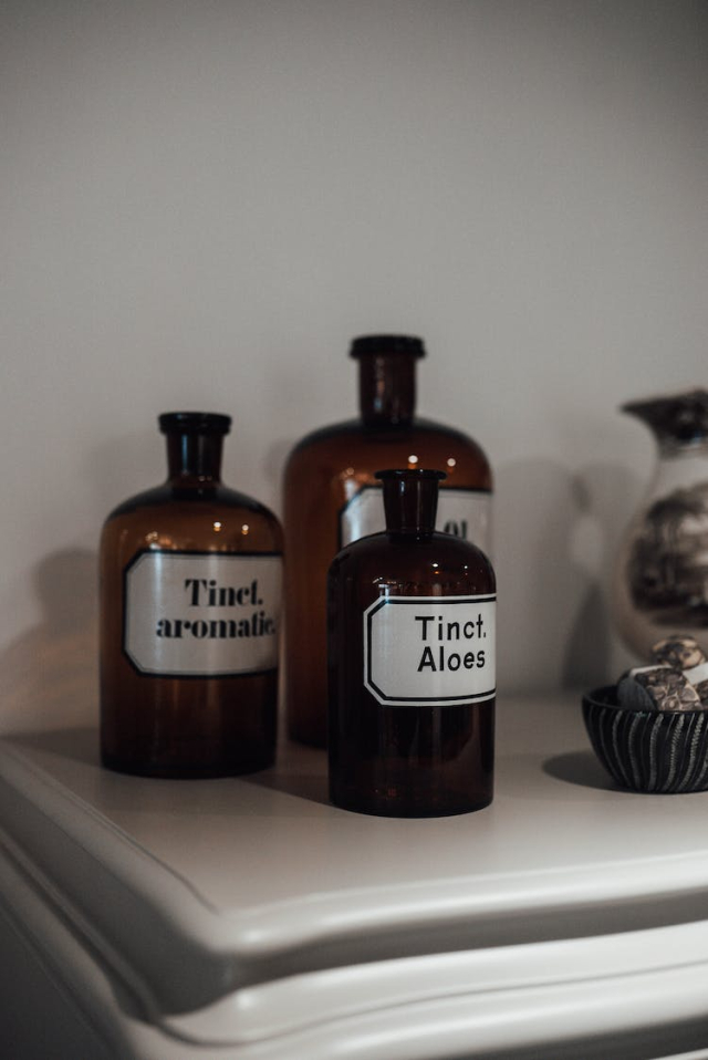 Bottles of natural essential oils on shelf in store