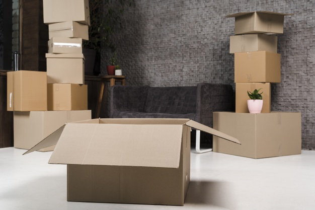 Collection of cardboard boxes ready to be moved Free Photo