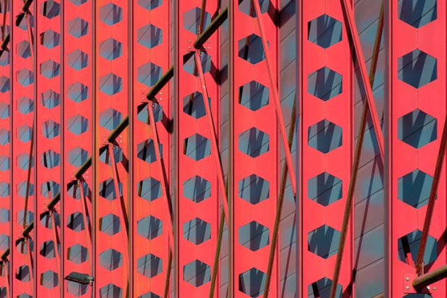 Concrete Building With Decorative Red Steel Frames