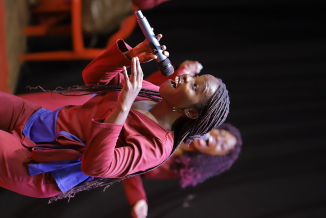 Dynamic Female Vocalist Performing on Stage