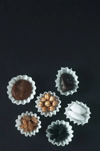 Eid Mubarak. Different iftar sweets. Celebrating Eid Al Adha. Islamic traditional holiday. Eid al-Fitr. Holly month Ramadan. Middle Eastern religious holiday. Dried date fruit. Flat lay, top view.
