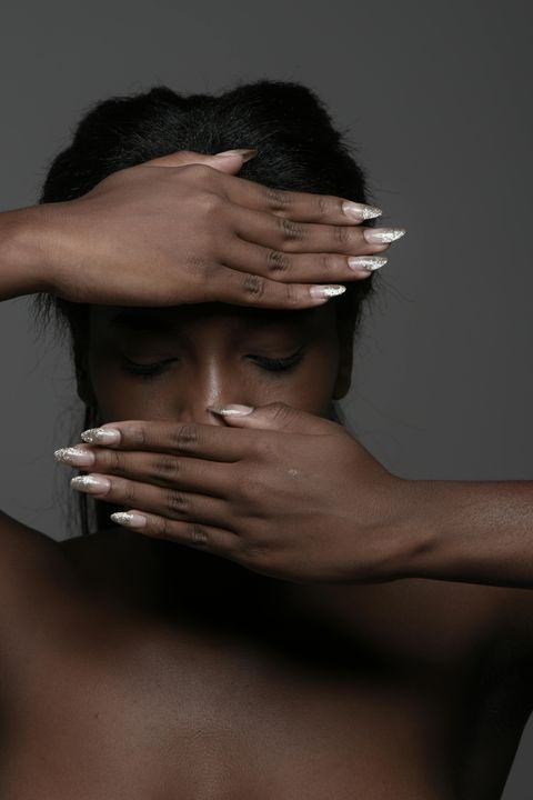 Elegant Portrait of a Woman with Hands Over Face