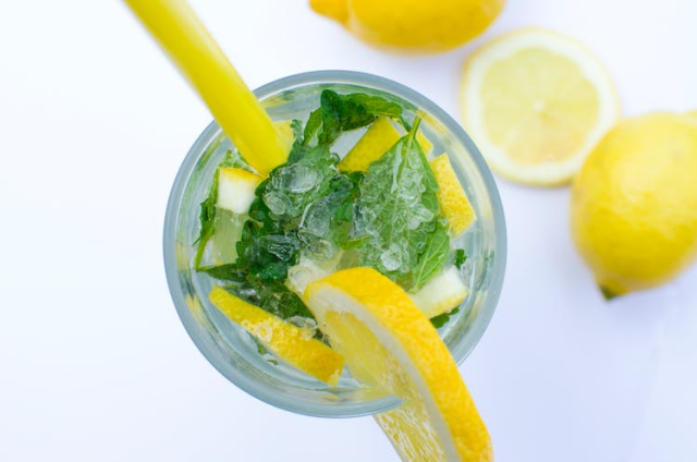 Flat Lay Photograph of Highball Glass With Sliced Lemon