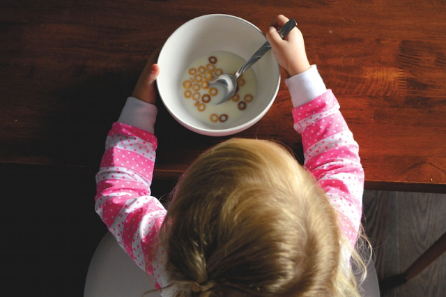Free kid having cereals image, | Free Photo - rawpixel