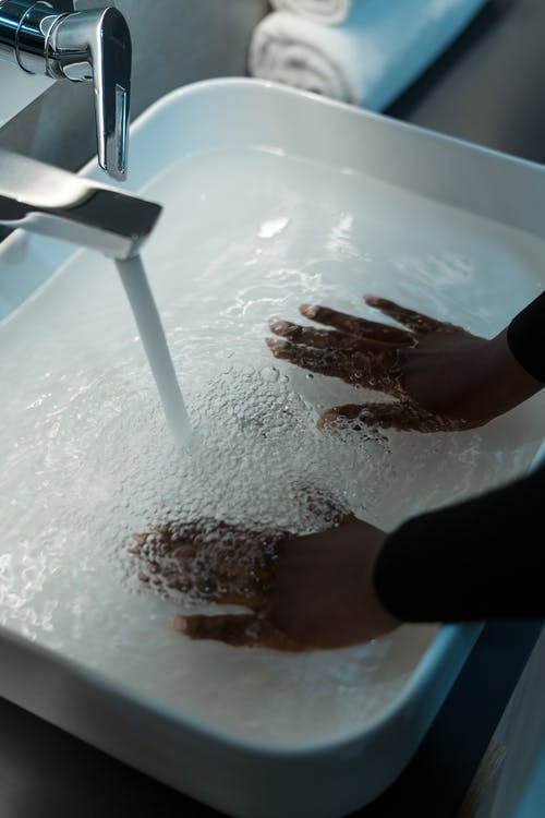 Hands Immersing in Sink with Water · Free Stock Photo