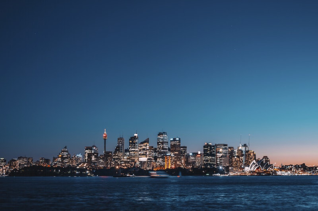 Illuminated buildings and skyscrapers in the distance, | Free Photo - rawpixel
