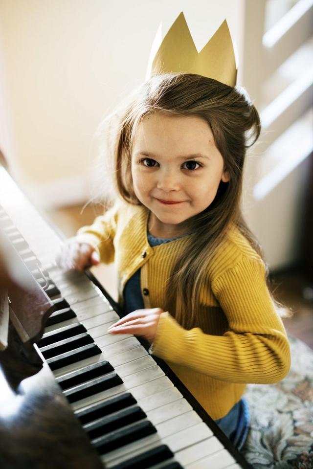 Little girl playing a piano | Free Photo - rawpixel