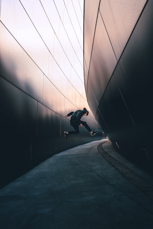 Photo of Man Jumping on Pavement