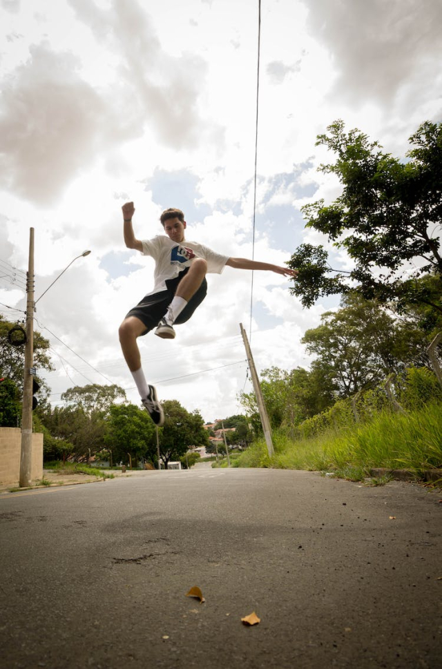 Photo of Man Jumping on the Street