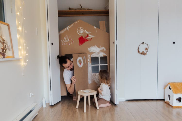 Photo Of Man Looking On Child